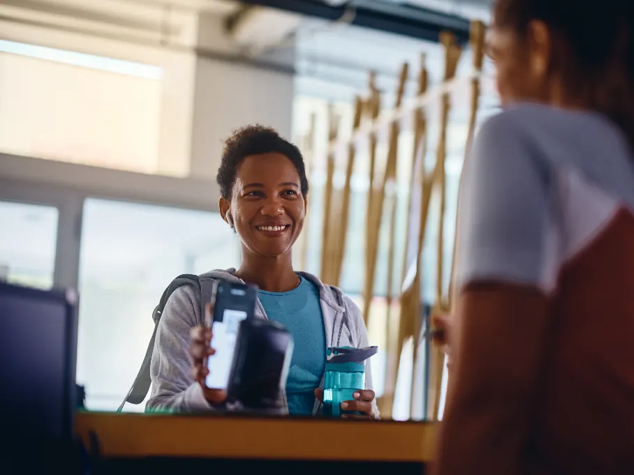 Gym owner working through payment notes and paperwork